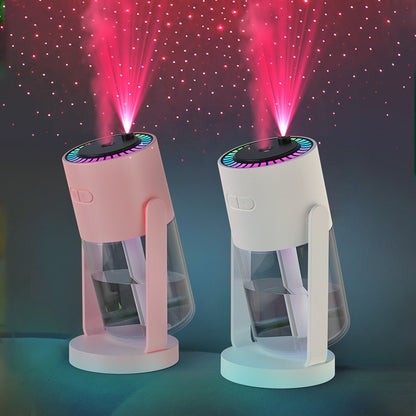 Two colorful lamp projectors with star-like projections on a dark background