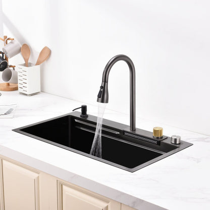 Close-up of waterfall faucet feature on black stainless steel single bowl kitchen sink 