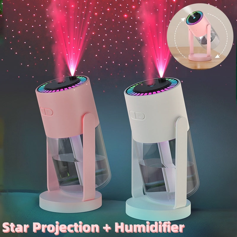 Two star projection humidifiers, one pink and one white, on a dark background with starry effect.