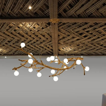 Chandelier with branch-like design hanging from a woven wooden ceiling.