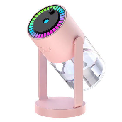 Pink humidifier with colorful light display on a white background