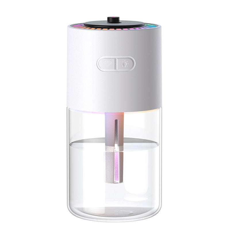 White and clear glass humidifier with colorful light on a white background