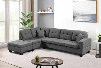 Gray sectional sofa in a living room setting with a coffee table and decor items.